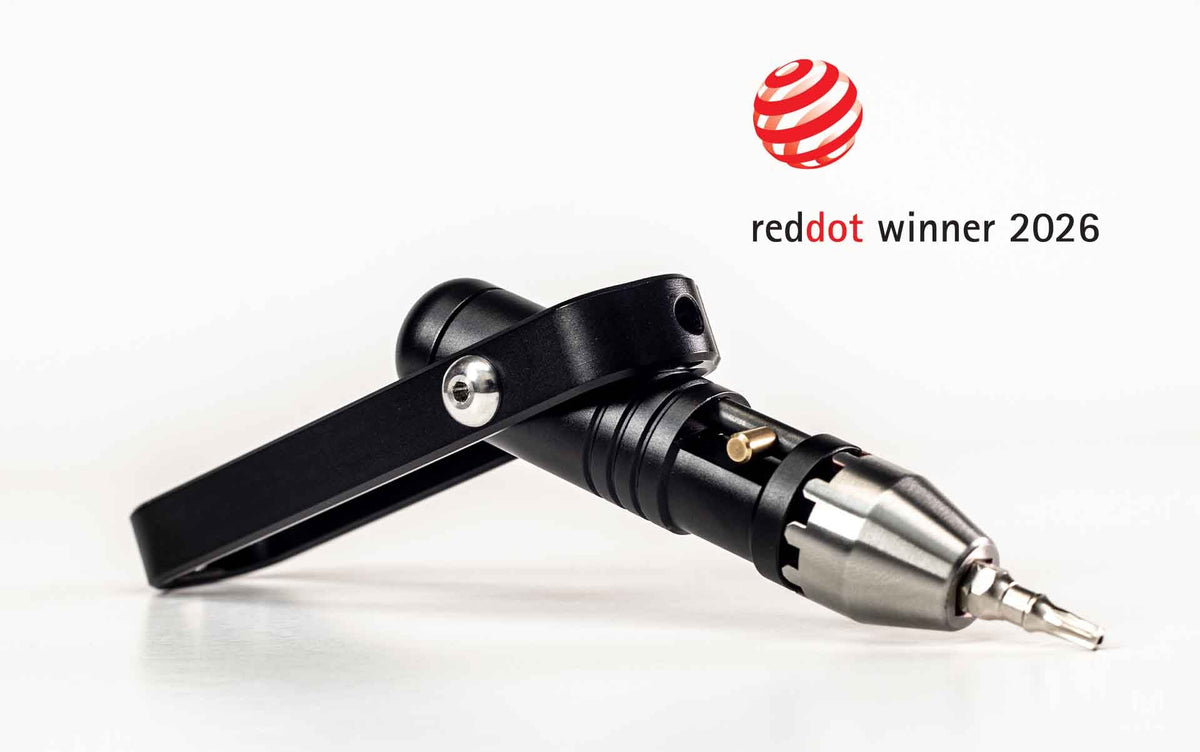 Black Pocket Driver with Red Dot Winner 2026 badge