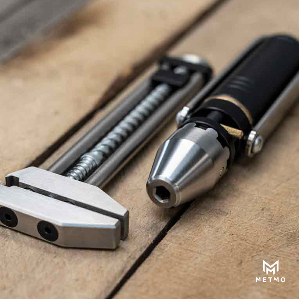 MetMo Grip and Driver tools on a wooden surface.