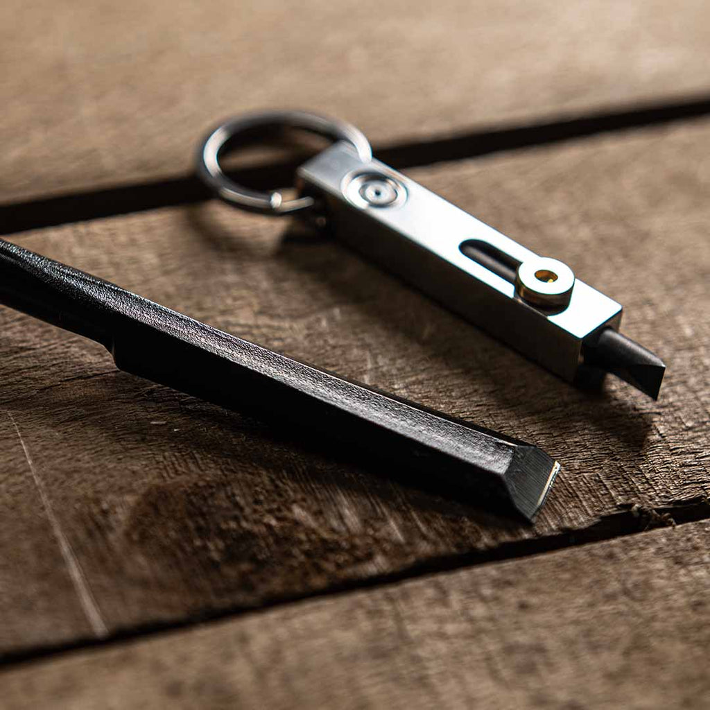 A variety of MetMo tools and accessories including the Driver, Grip, and Pocket Driver on a wooden background