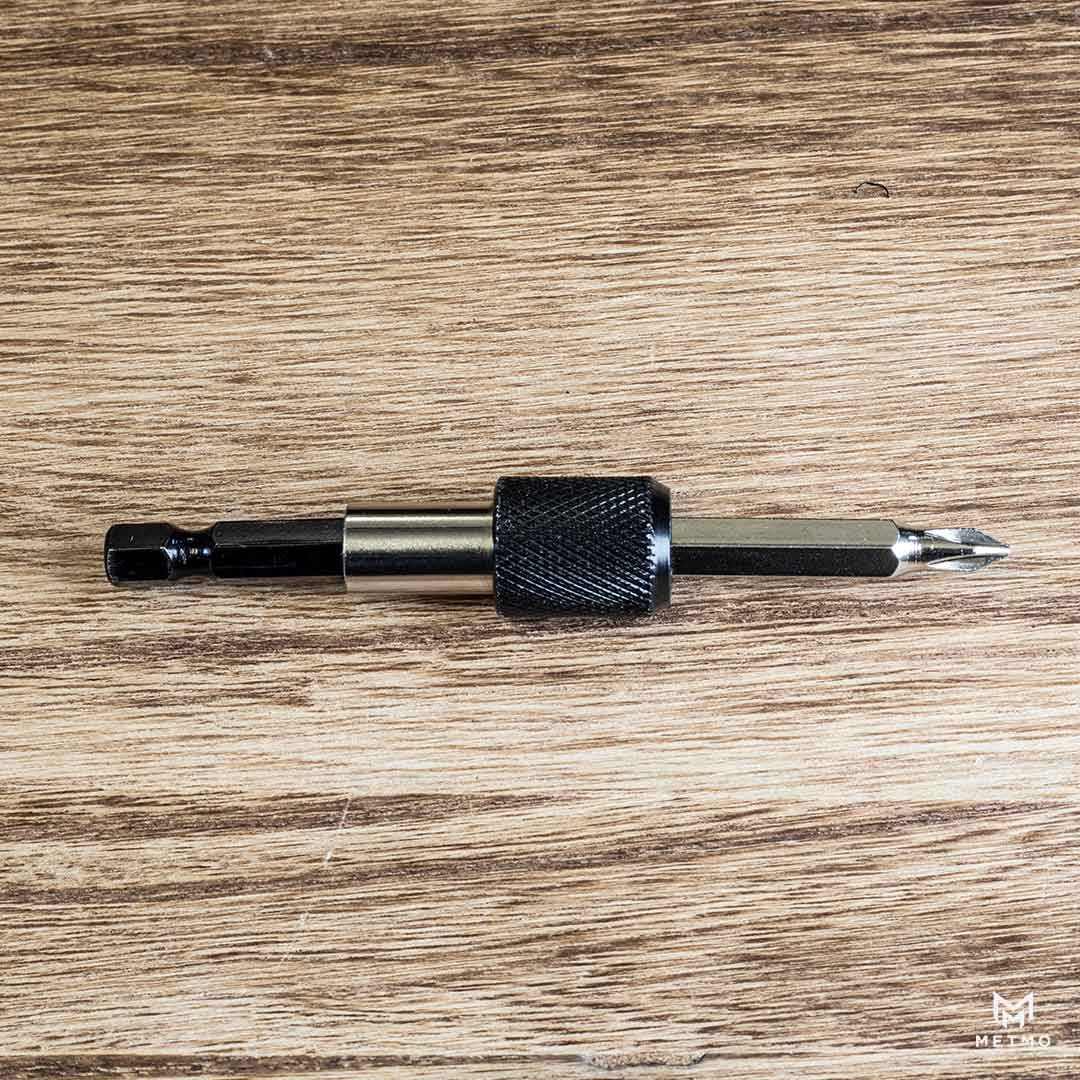 MetMo Black Steel Driver 60mm bit extender on a desk