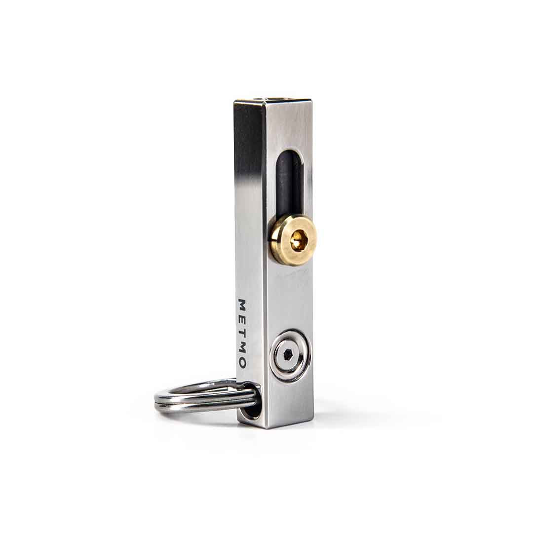 Stainless Steel and brass metmo edge tool on a white background