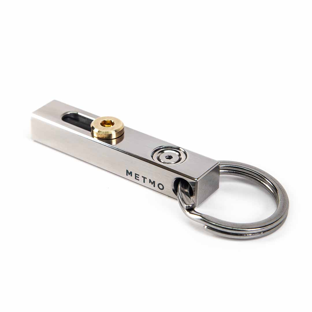 Stainless Steel and brass metmo edge tool on a white background