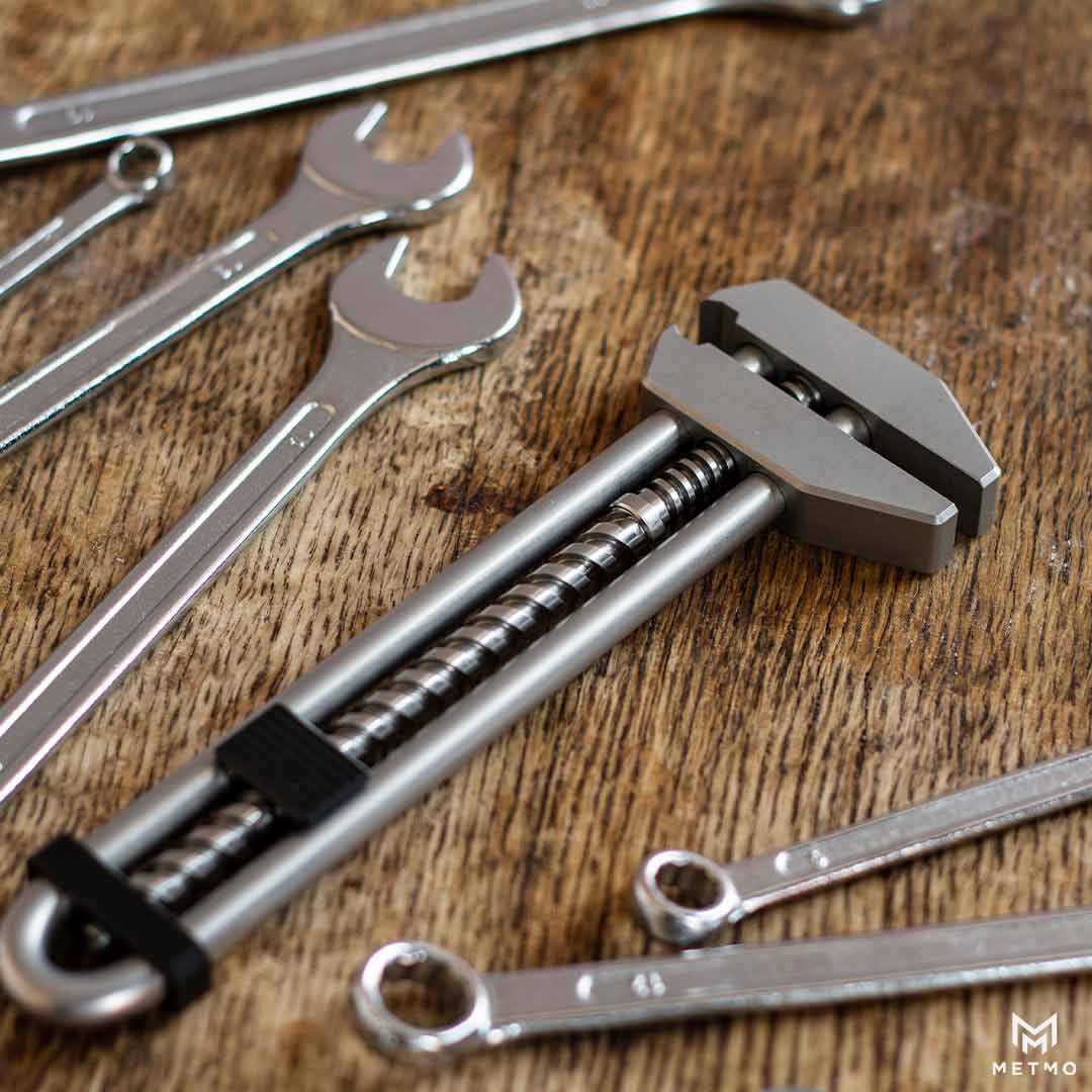 MetMo Grip, on a workbench with spanners, and wrenches.