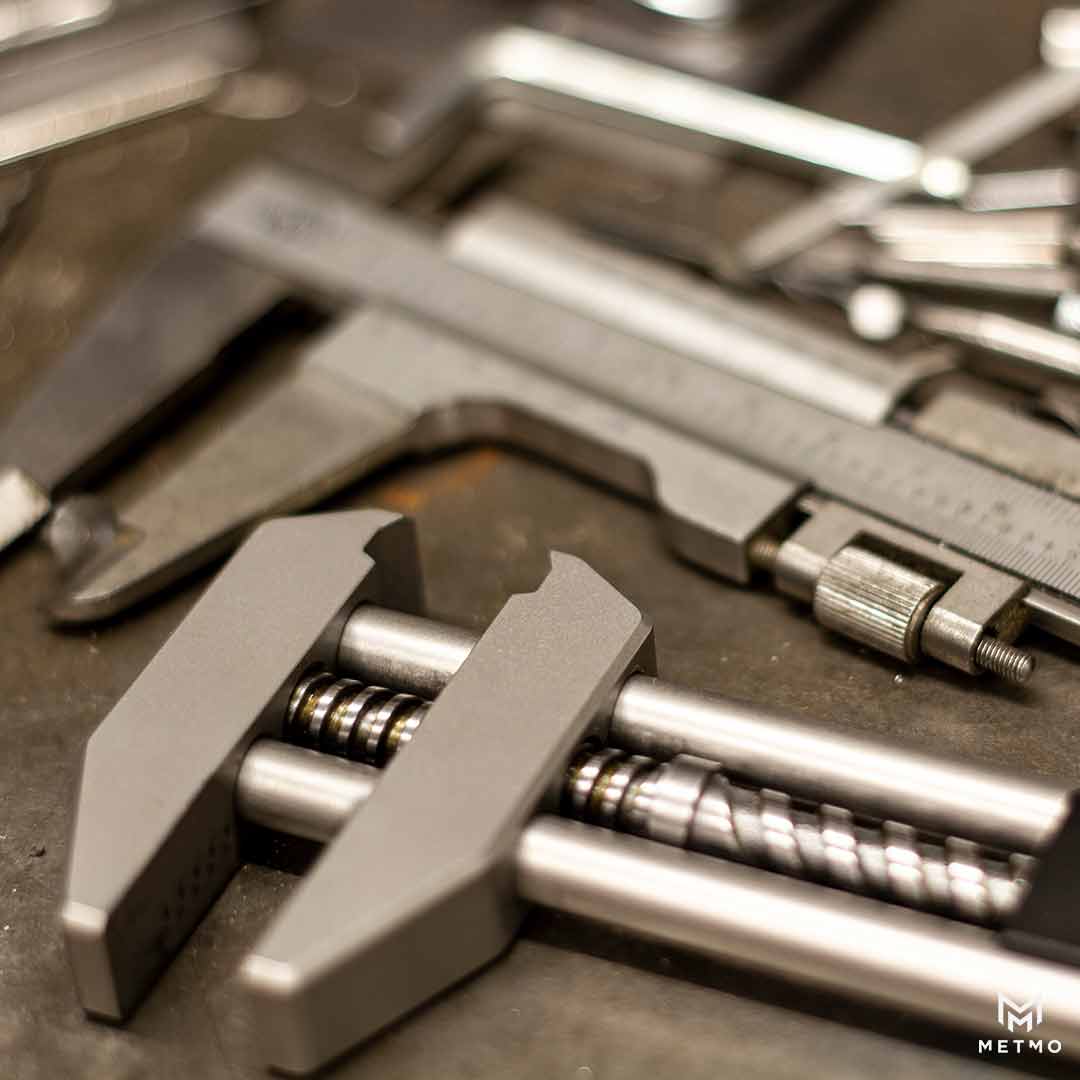 MetMo Grip, laying in a workshop on a workbench.