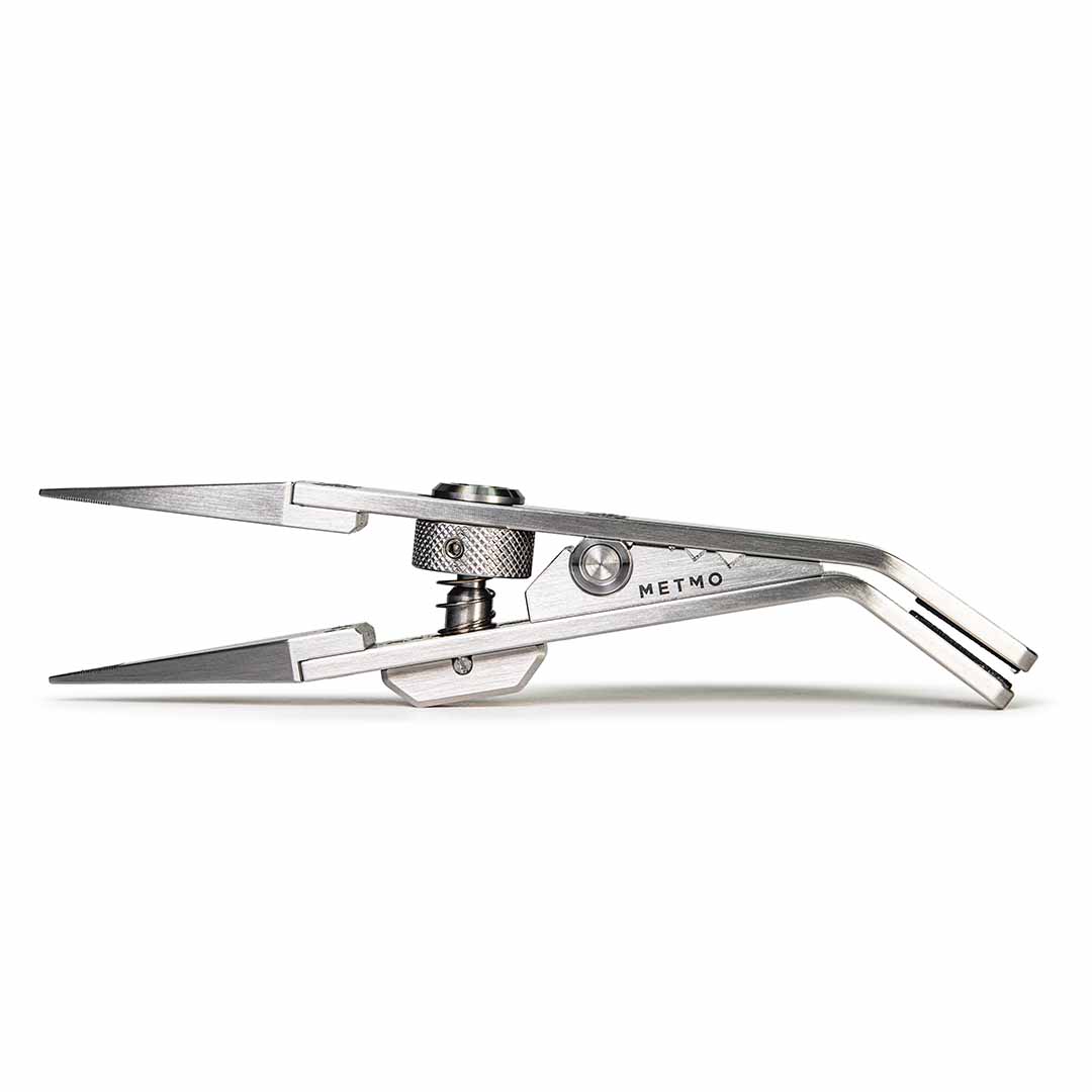 A stainless steel precision tool with the brand name 'METMO' engraved on its side, shown against a plain white background.