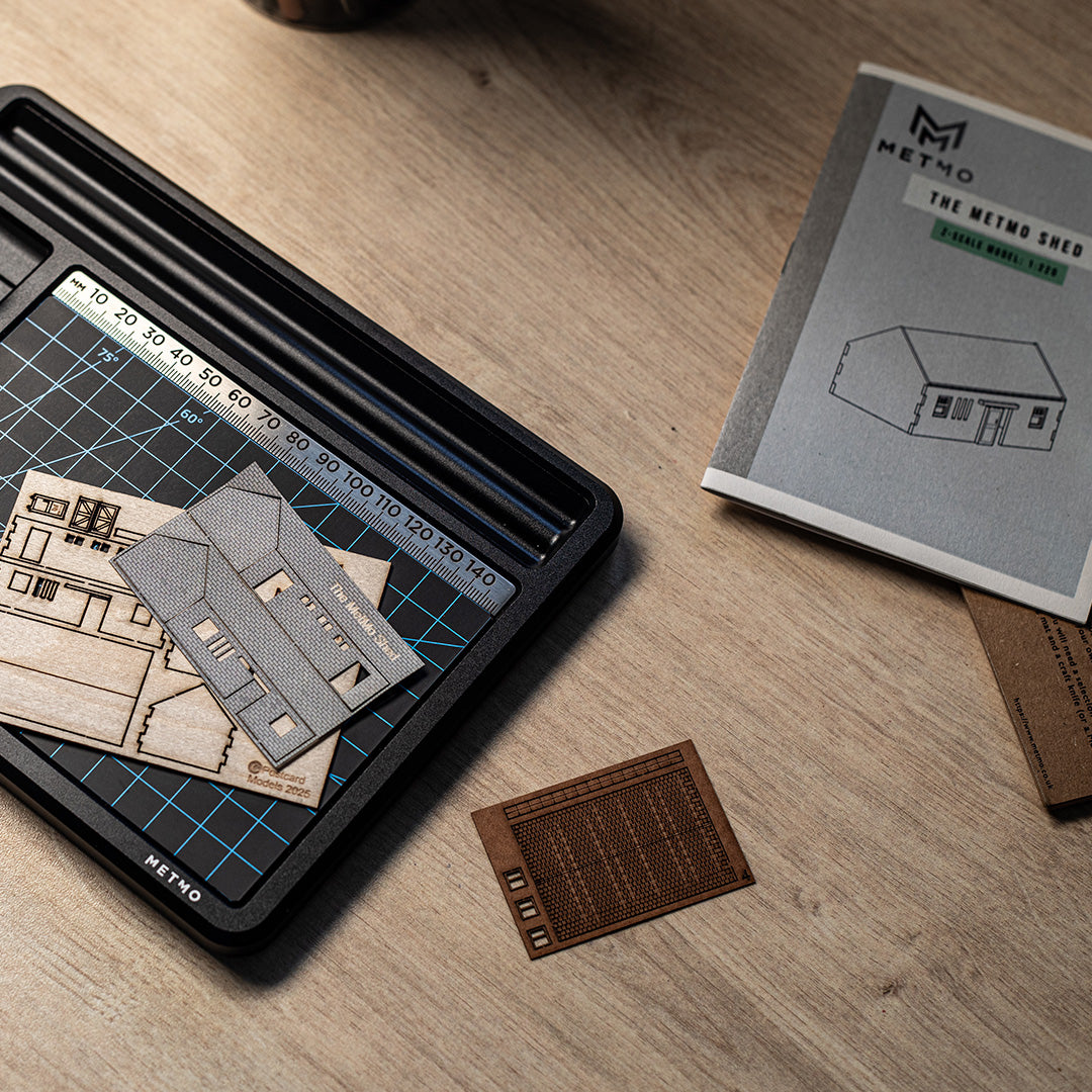 MetMo shed pieces laid out on a work surface