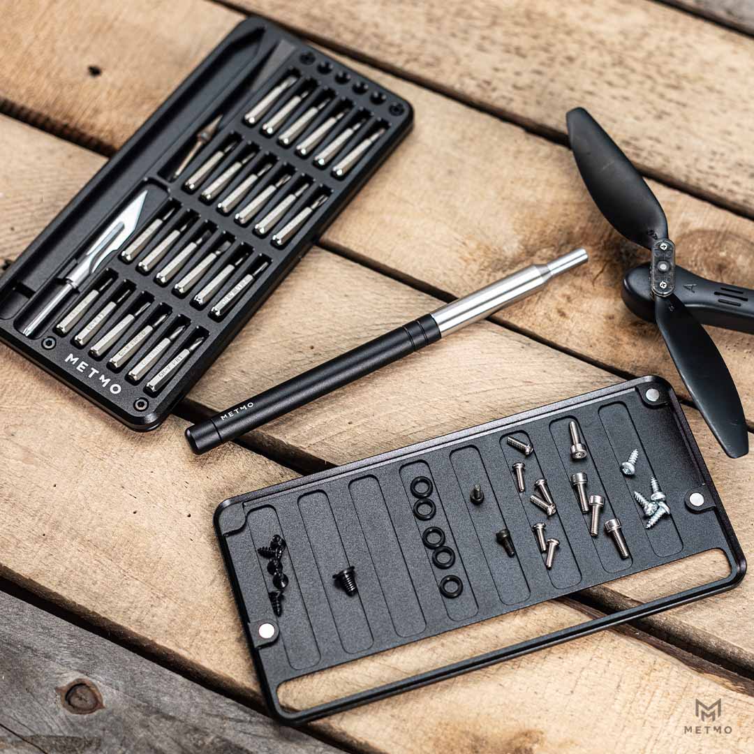 Multi Drive Metal Case open on workbench showcasing the tools and accessories