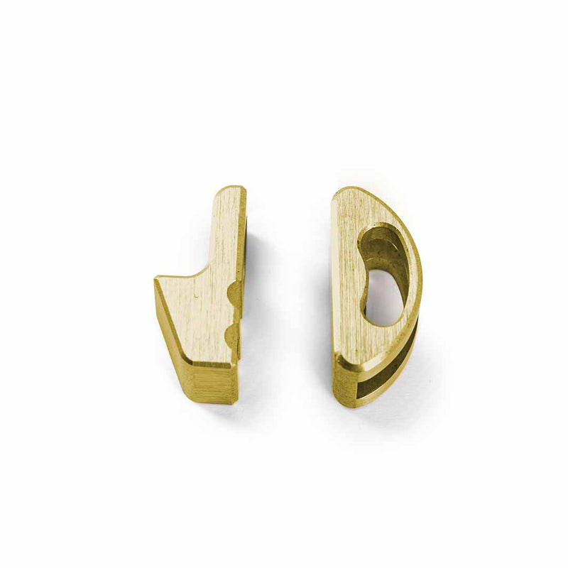 Close up of brass adaptive jaw for pocket grip on white background