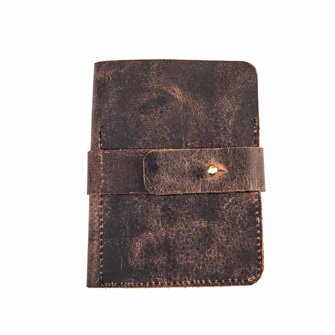 Brown leather pouch with a strap closure on a white background