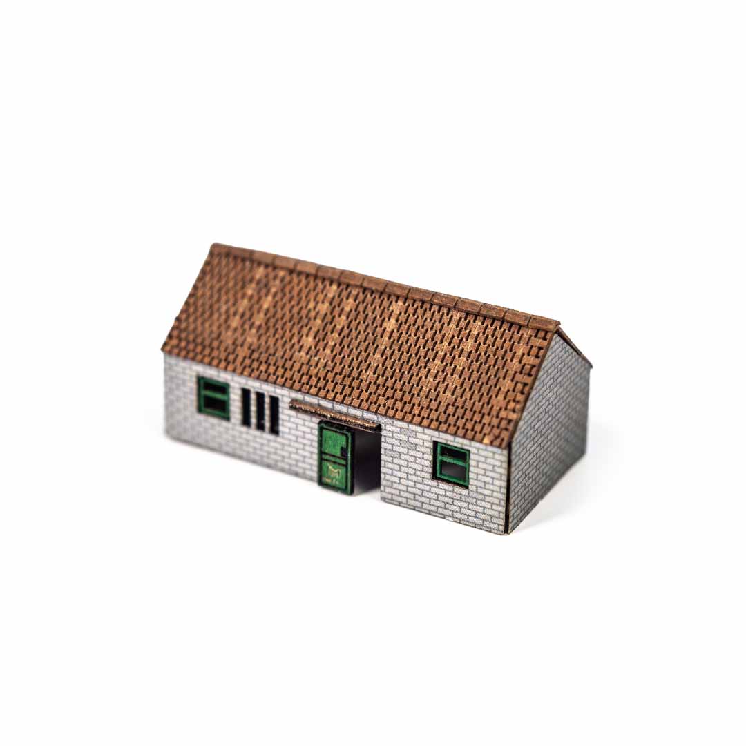 Scale model of a shed with a tiled roof on a white background