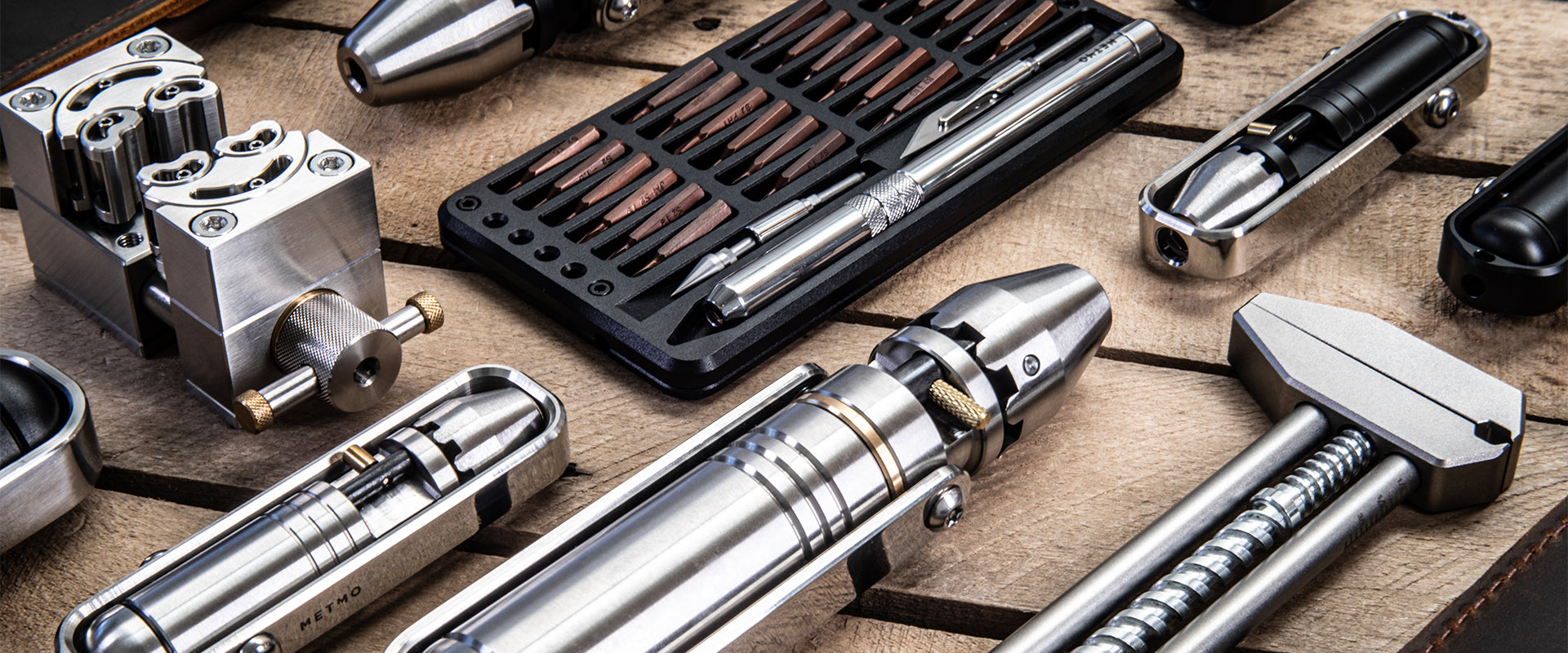 Collection of MetMo tools and equipment on a wooden surface