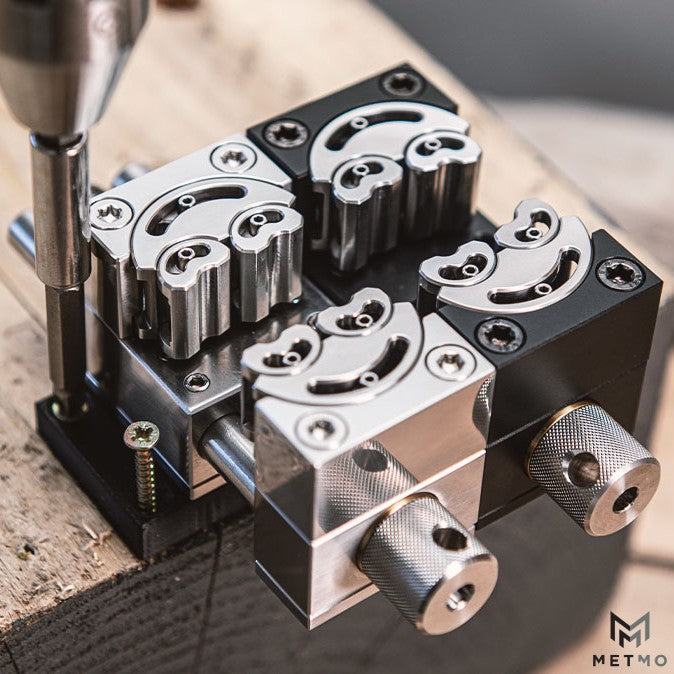 MetMo fractal vice dual plate adaptor image showing plate being fixed to wooden surface with screws