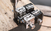 Adaptor plate bolted to bench