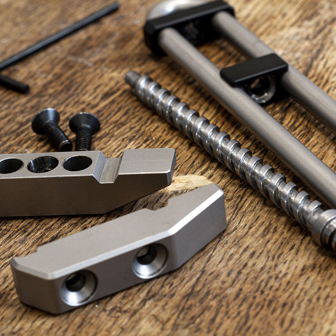 Parts of the MetMo Grip disassembled on a workbench 