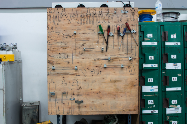 Organised tools on a peg board 