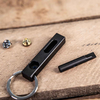 MetMo edge components on a table, including the Edge body, the blade, the magnet, and the brass attachment. 