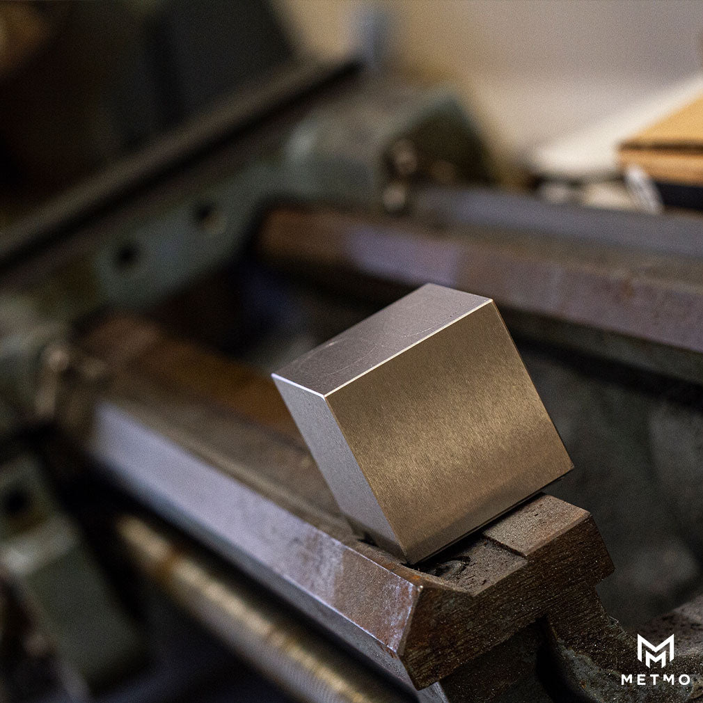 MetMo Cube with precision ground surfaces on a lathe. 