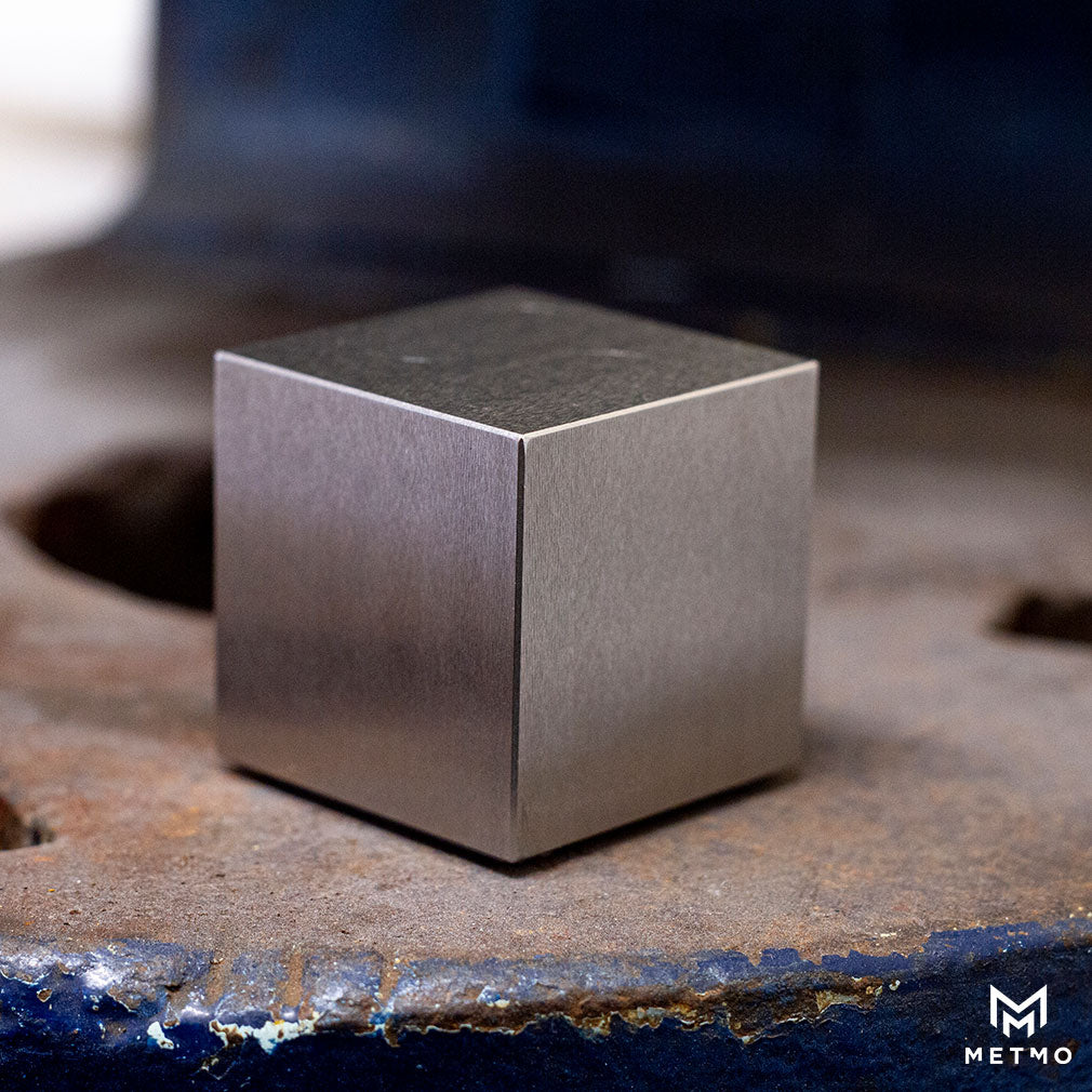 Solid steel, MetMo Cube on a metal press