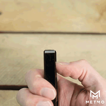 Pushing up a drive bit for easy access from the magnetic bit case. 