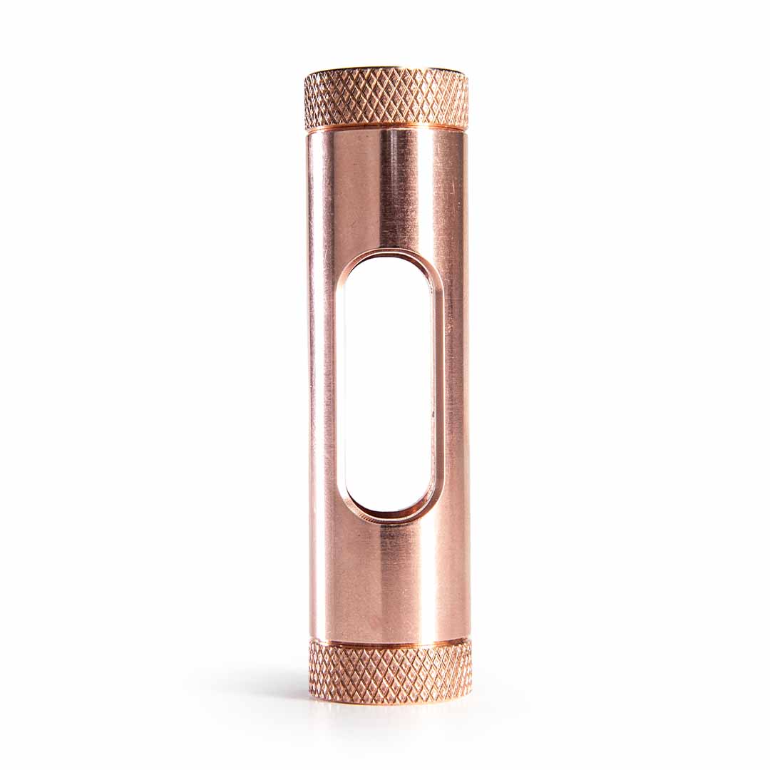 Metmo Eddy science desk toy A metallic copper cylinder with a central oval cutout and textured knurled ends, shown vertically on a clean white background.