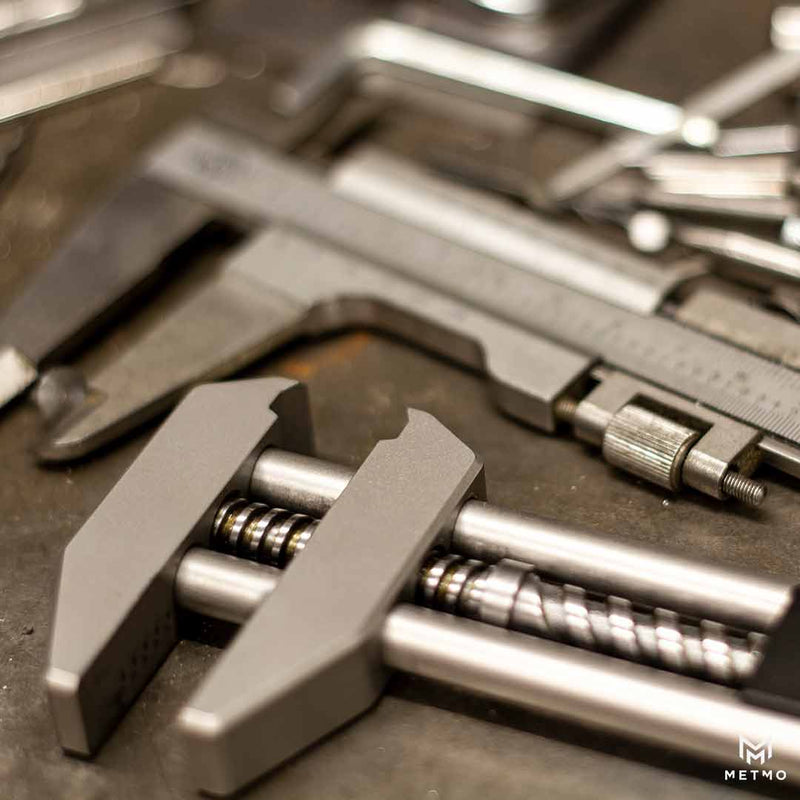 MetMo Grip, laying in a workshop on a workbench. 