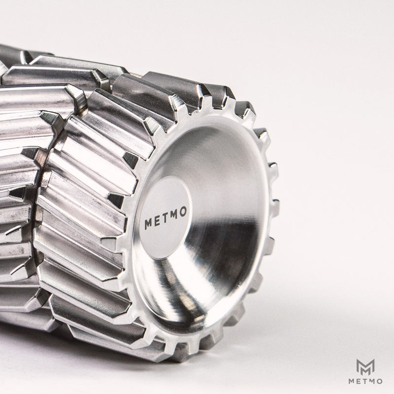 Close up of Helico herringbone gear design on a white background