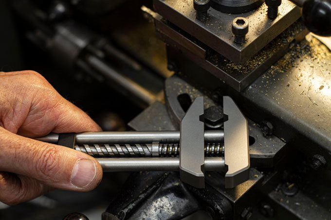 Side view of MetMo Grip tool tightening a  workbench bolt.