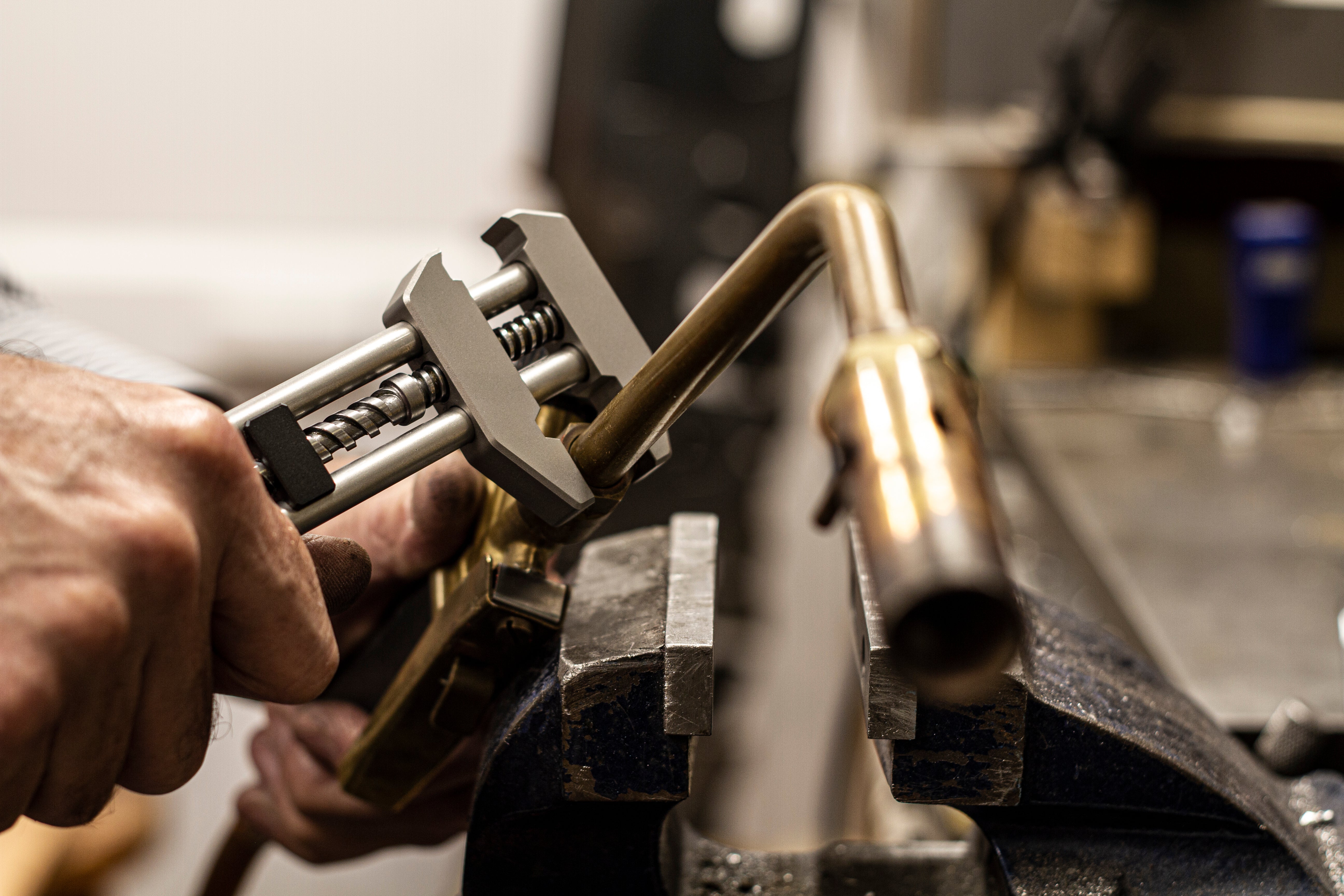 MetMo Grip tool positioned on a metal surface, ready for use.