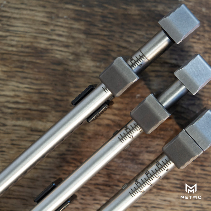 three metmo grips next to each other open at different points to see the laser engraved size markings