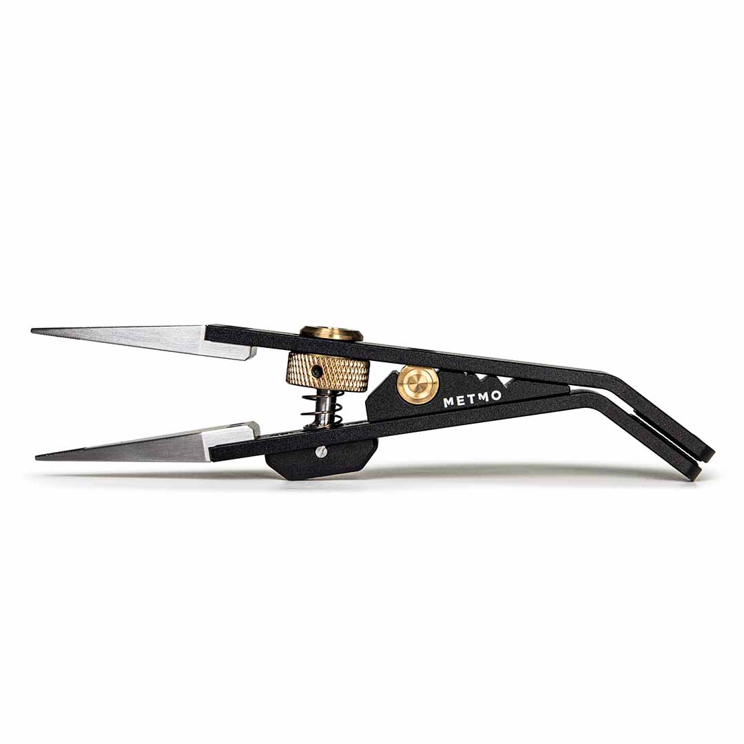 Black metal precision tweezers with silver stainless steel tips, gold-tone adjustment screws, and the brand name 'METMO' printed on the side, shown against a plain white background.