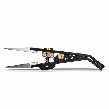 Black metal precision tweezers with silver stainless steel tips, gold-tone adjustment screws, and the brand name 'METMO' printed on the side, shown against a plain white background.