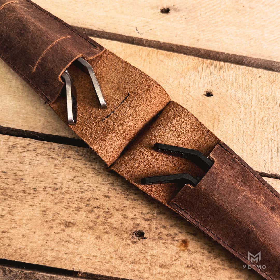 Leather case holding 2 precision grips 