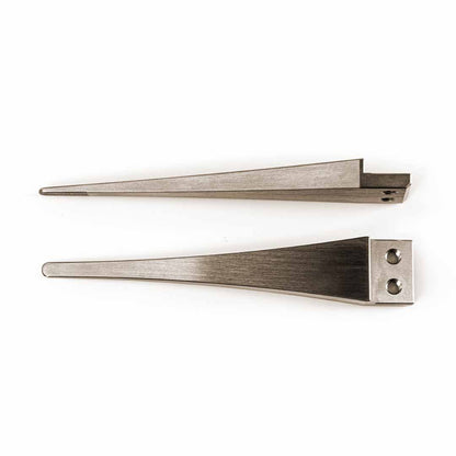 Two silver metal long wedge-shaped tool tips with different edge grooves and attachment holes, displayed side-by-side on a plain white background.