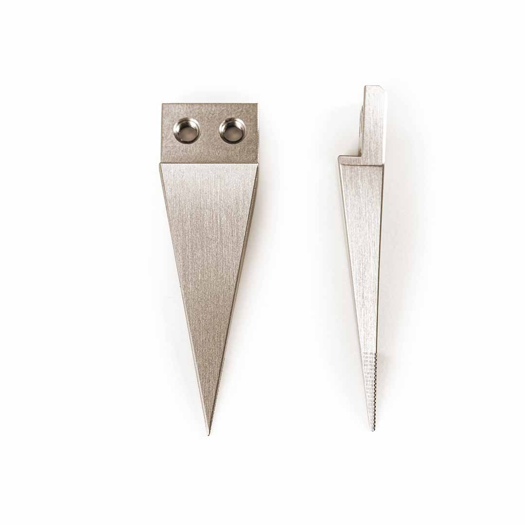 Two silver metal wedge-shaped tool tips with different edge grooves and attachment holes, displayed side-by-side on a plain white background.