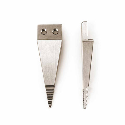 Two silver metal wedge-shaped tool tips with different edge grooves and attachment holes, displayed side-by-side on a plain white background.