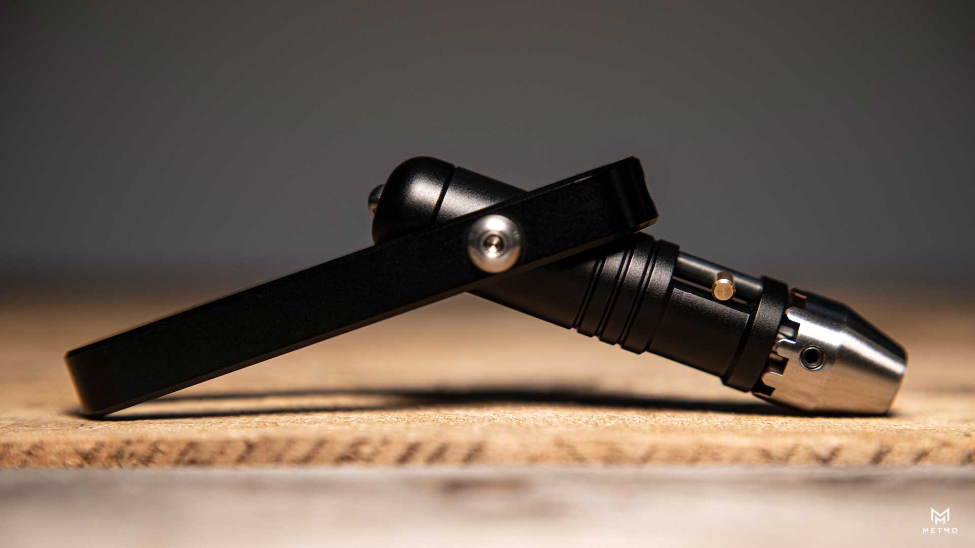 Side view of the MetMo Pocket Driver, highlighting its ergonomic design and metal construction.