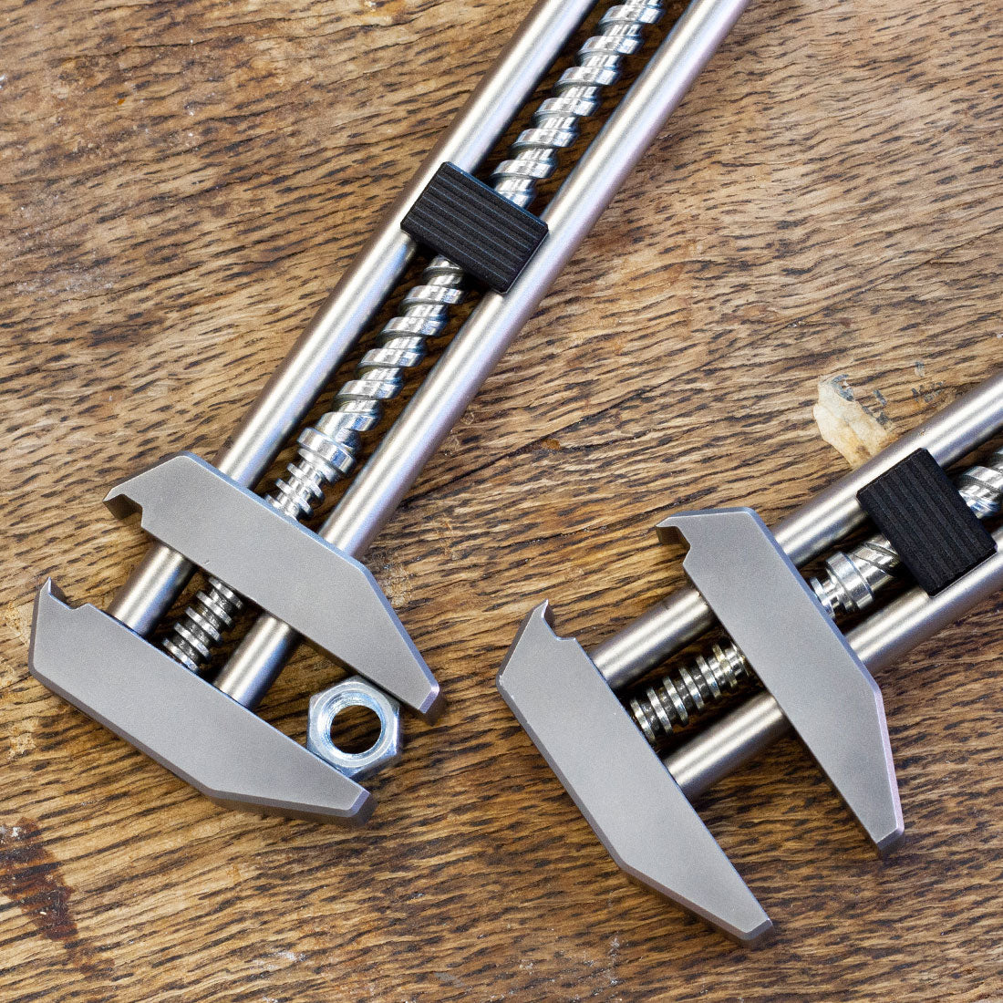 Two Metmo Grips - one clamping round a screw bolt.