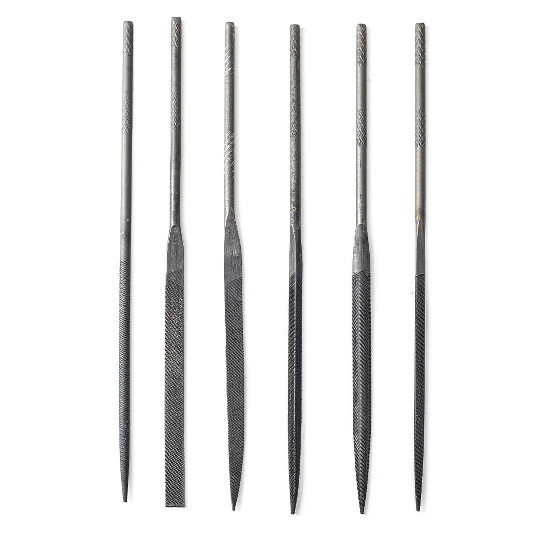 6 needle files on a white background