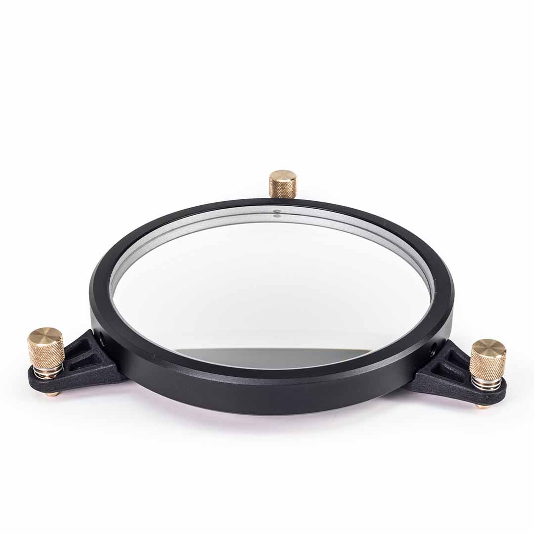 A circular black metal mounting frame with a clear glass center and three brass-adjustment knobs, shown on a plain white background.