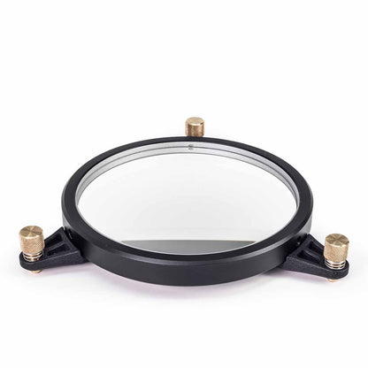 A circular black metal mounting frame with a clear glass center and three brass-adjustment knobs, shown on a plain white background.