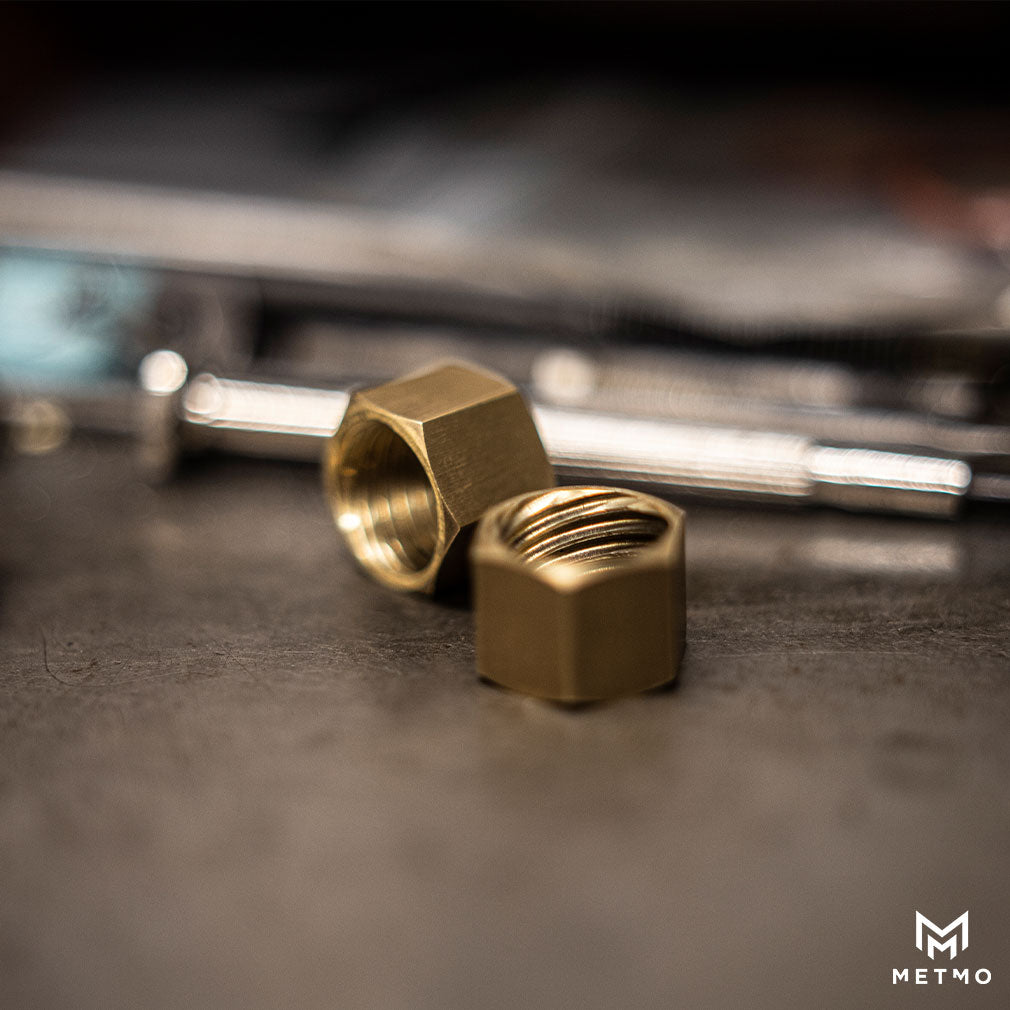 Dual threaded nuts on the workbench for a metmo Pen