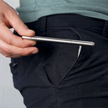 Person removing the MetMo Multi Drive from the front pocket of their trousers.