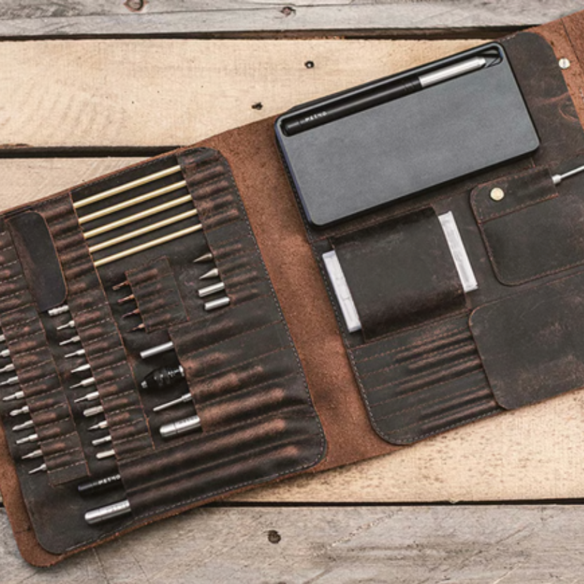 Open MetMo Multi Drive Expansion Kit filled with a number of tools including the MetMo Multi Drive and metal case, and the MetMo Power Pocket Driver.
