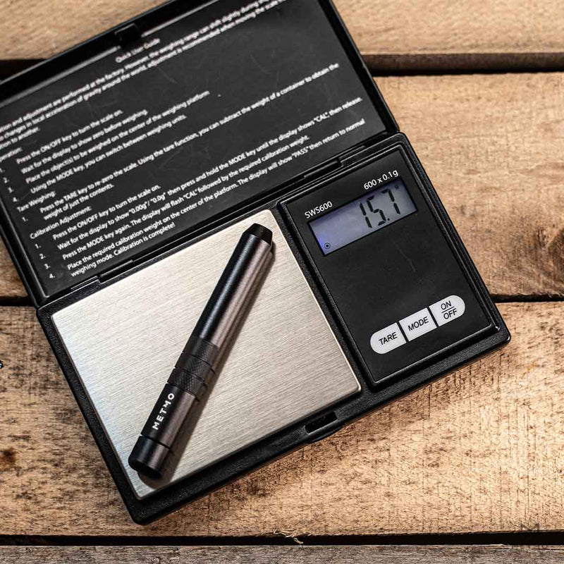 MetMo Black Aluminium Stubster on a scale, showing weight of 15.7 grams.