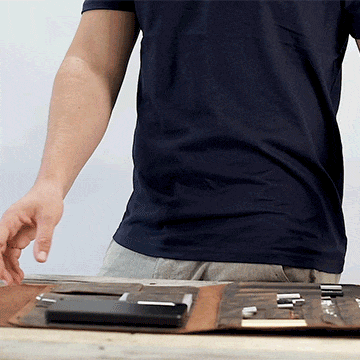 Person closing and fastening the MetMo Multi Drive Expansion Kit. 