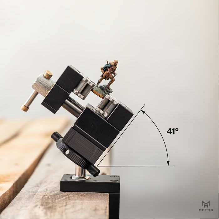 MetMo fractal vise holding small figurine mounted on ball joint allowing for tilted position