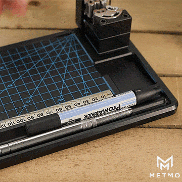 metmo workstation showing pen being slotted into handy groove alongside a multi drive