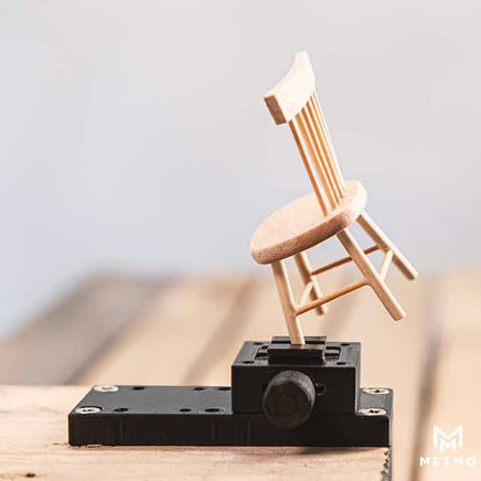 MetMo fractal vice quick release addon holding tiny wooden chair side view image