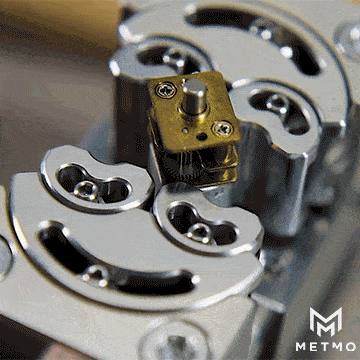 stainless steel fractal vice gif being closed on brass mechanism