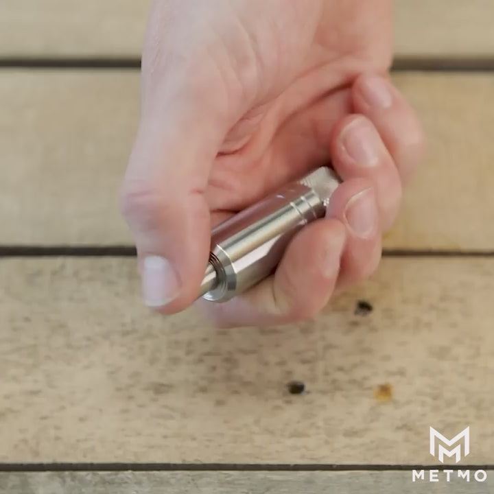 Load video: metmo piston - stainless steel air bearing fidget toy, video shows hand fidgeting with the toy